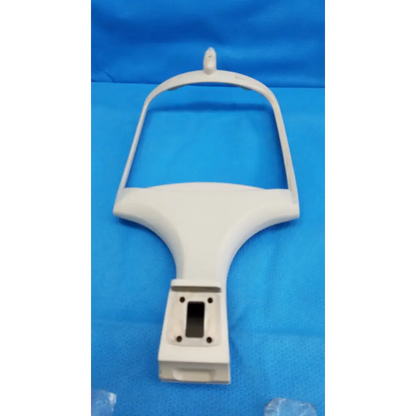 White plastic mounting bracket with curved top and four screw holes for trc-nw6s chin rest forehead assembly frame