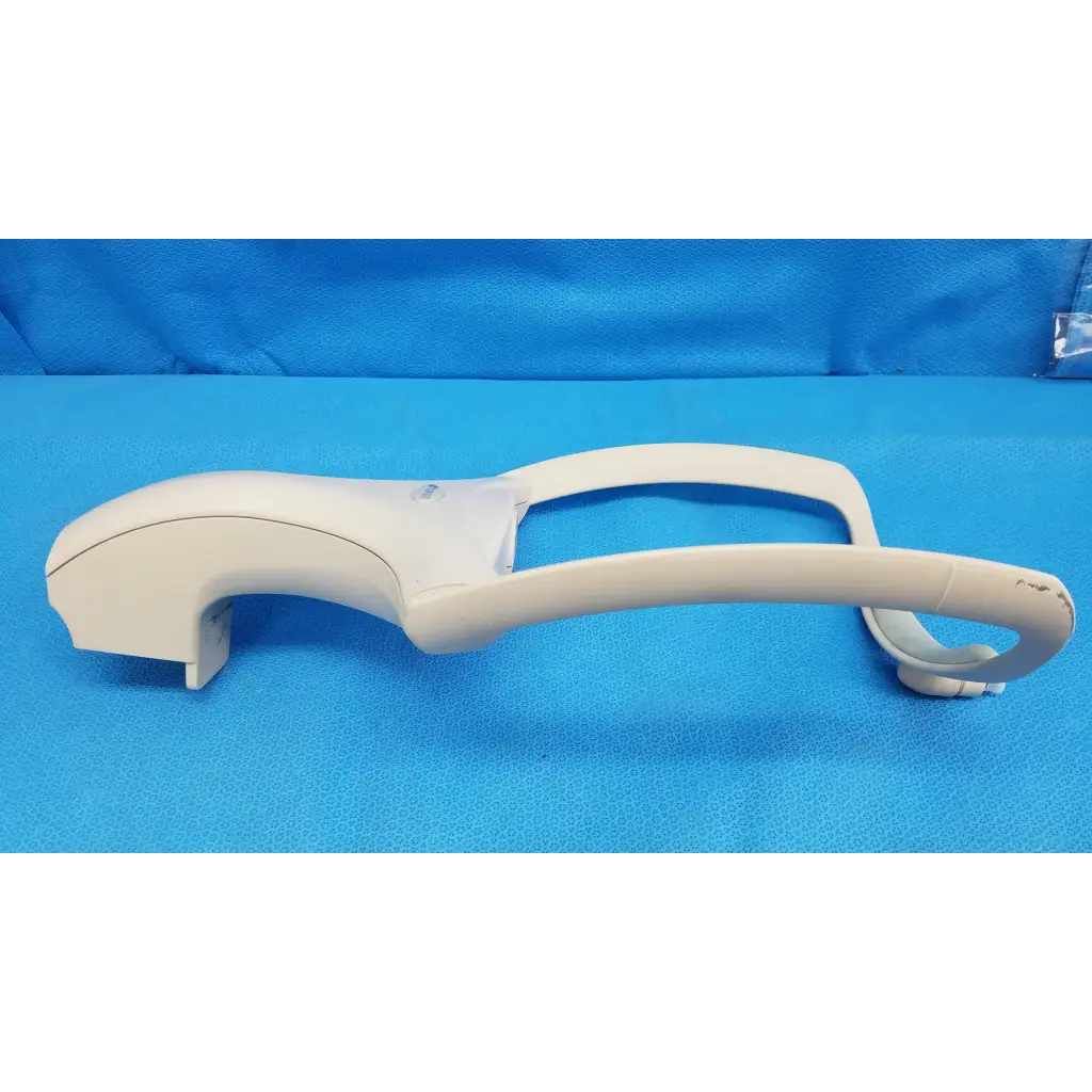 White plastic handle with curved ergonomic design and integrated grip for trc-nw6s chin rest forehead assembly frame