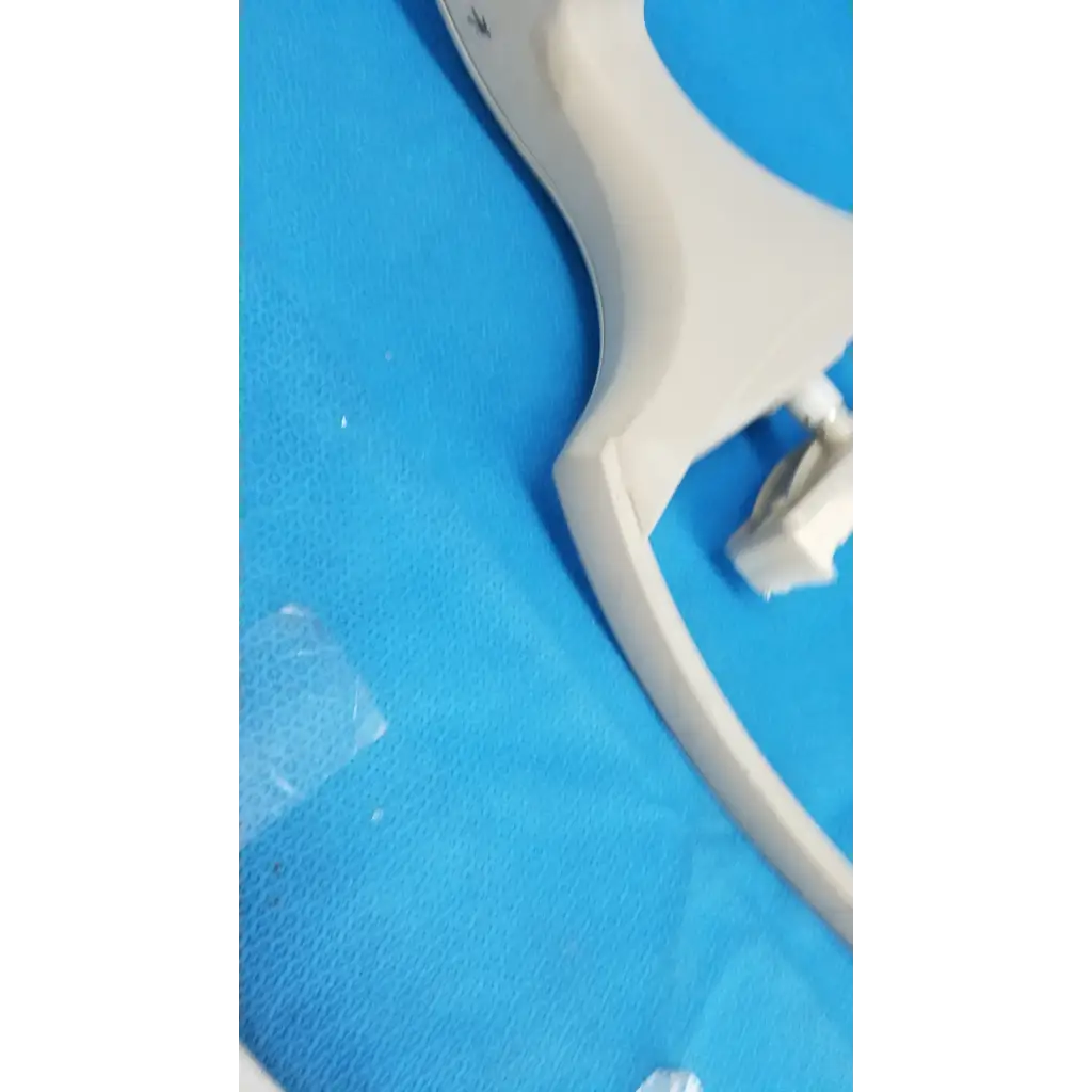 Off-white plastic medical speculum with ergonomic handle for chin rest forehead use with trc-nw6s chinrest paper