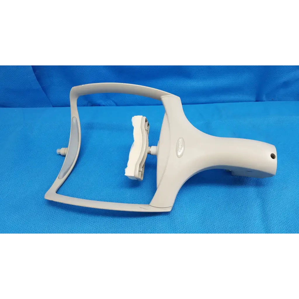 White plastic window cleaning tool with curved handle and squeegee for trc-nw6s chin rest forehead assembly frame