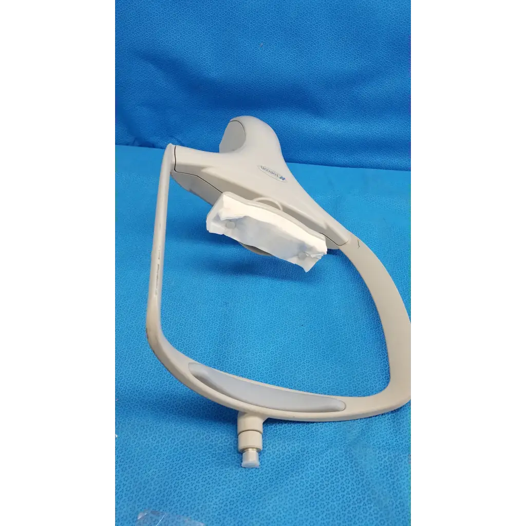 Beige plastic dental operating lamp with curved arm and adjustable head for trc-nw6s chin rest forehead assembly frame