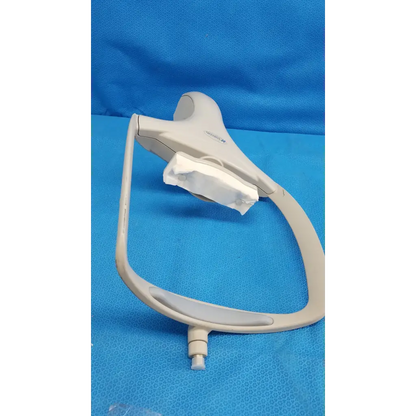 Beige plastic dental operating lamp with curved arm and adjustable head for trc-nw6s chin rest forehead assembly frame