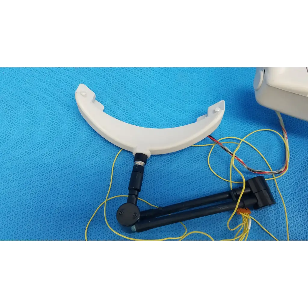 White plastic chin rest forehead rest assembly frame with black arm and yellow wiring for trc-nw6s retinal camera