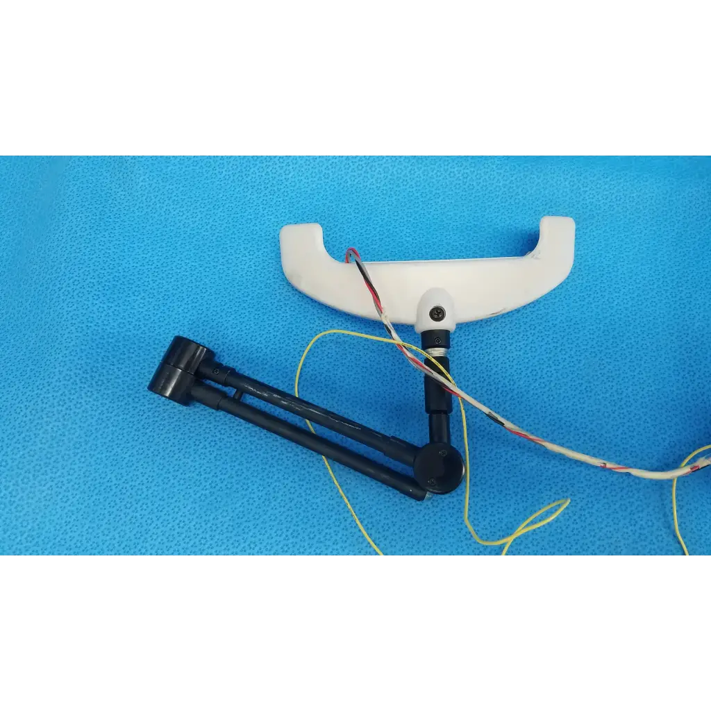 White plastic chin rest forehead rest assembly frame with black articulated arm and wires for trc-nw6s camera