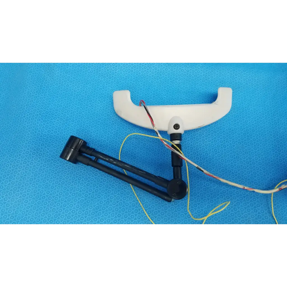 White plastic chin rest forehead rest assembly frame with black articulated arm and wires for trc-nw6s camera