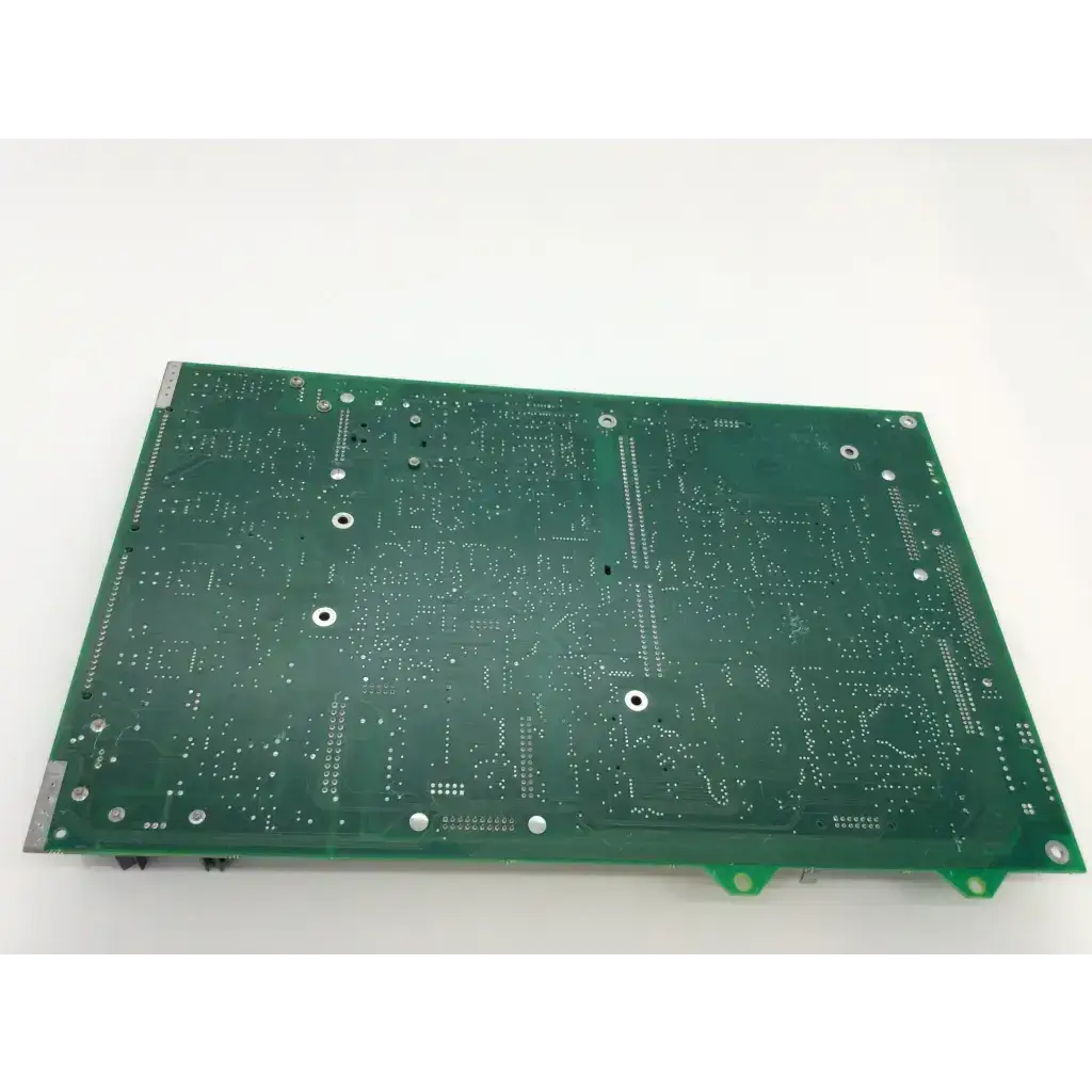 Green rectangular printed circuit board with silver solder points and mounting holes for chiron diagnostics rev g fab and rev d module