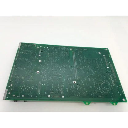 Green rectangular printed circuit board with silver solder points and mounting holes for chiron diagnostics rev g fab and rev d module