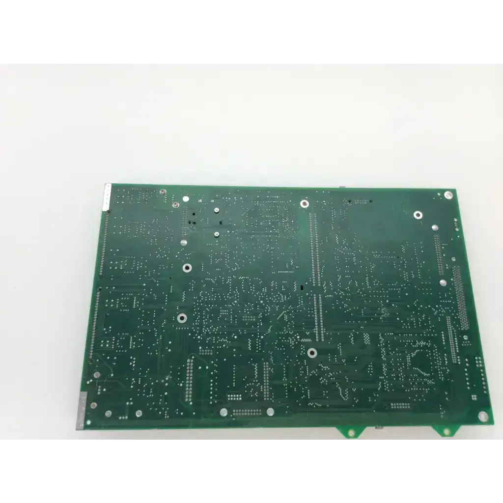 Green rectangular printed circuit board with silver solder pads and mounting holes for chiron diagnostics rev g fab rev d module