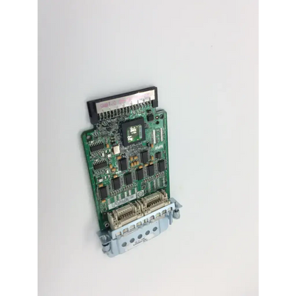 Green printed circuit board wan interface card with black integrated circuits and silver connectors featuring central chip