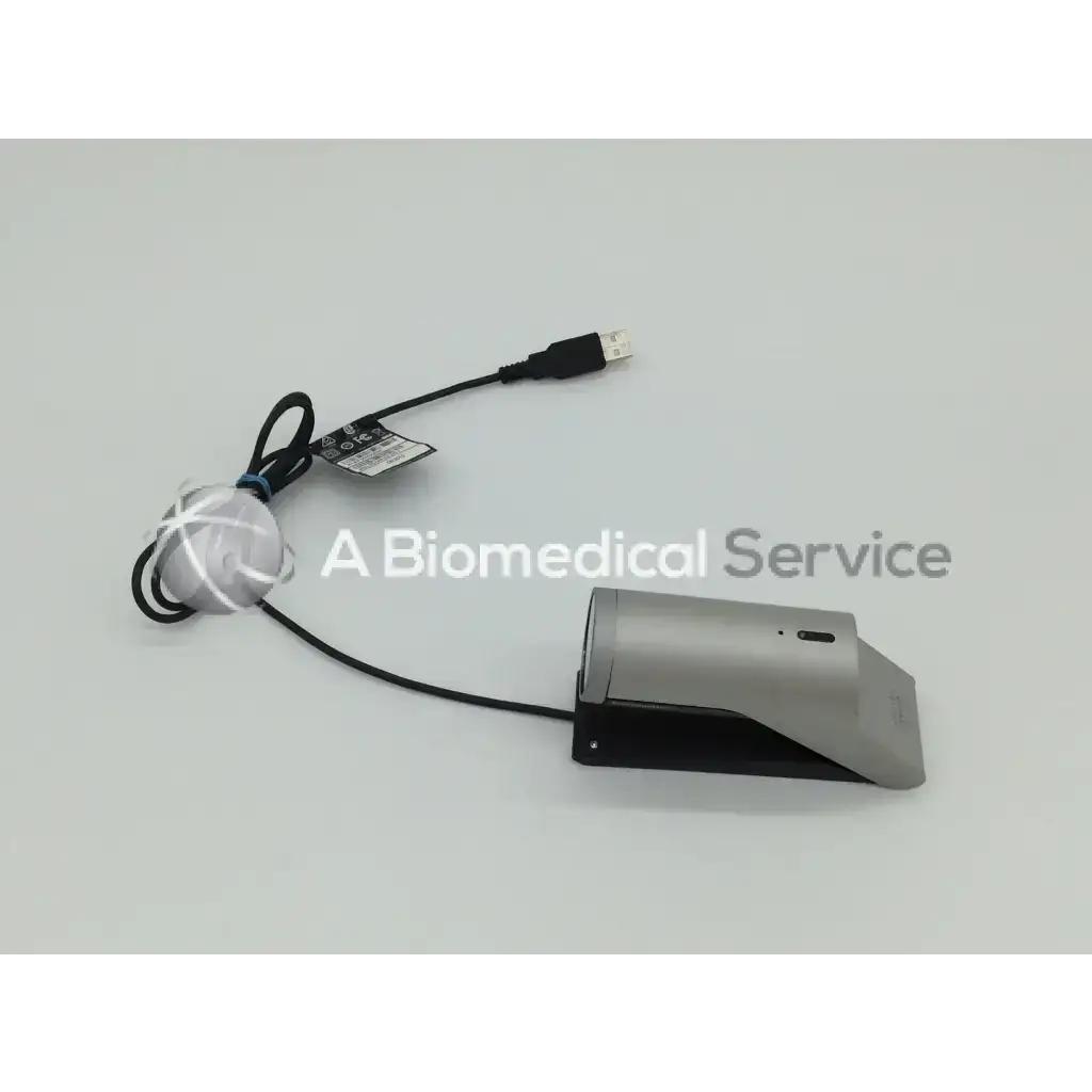 Silver and black foot pedal with usb cable for medical use in the Cisco Tandberg TTC8-03 precision HD degree view camera