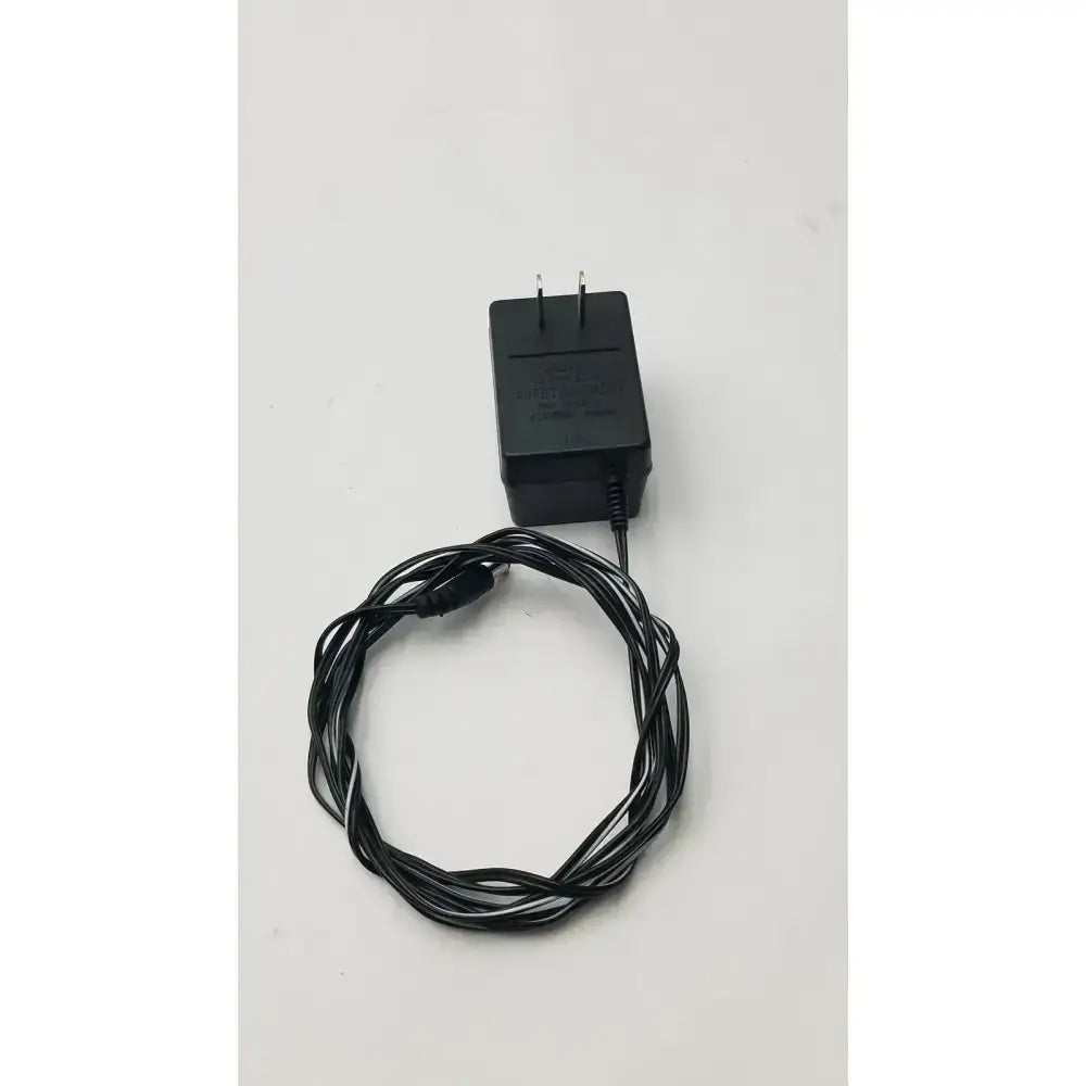 Black plastic class 2 transformer output 6vdc power adapter with coiled cable model 060-0400 6vdc ac adaptor