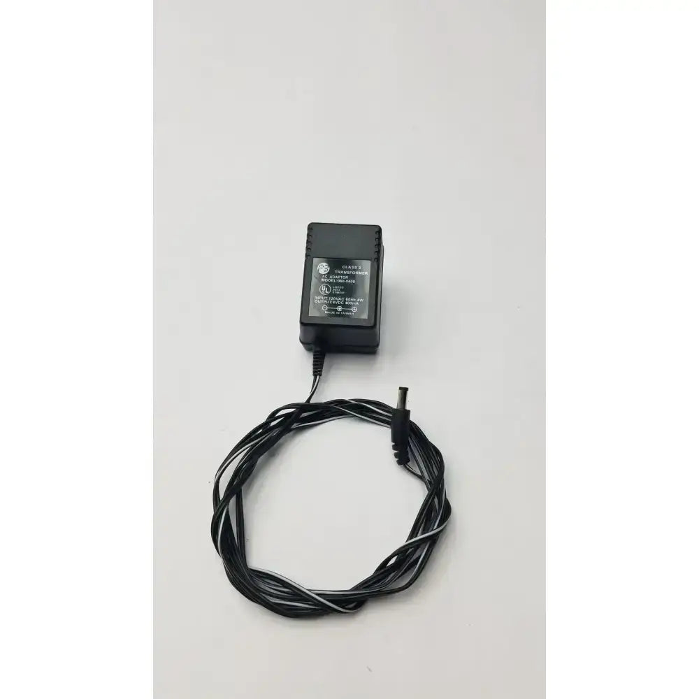 Black ge brand class 2 transformer output 6vdc power adapter with coiled black and white striped cord model 060-0400