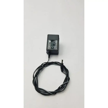 Black ge brand class 2 transformer output 6vdc power adapter with coiled black and white striped cord model 060-0400