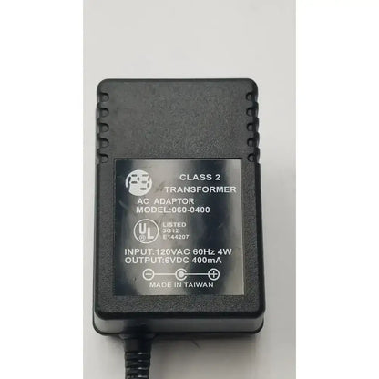 Black matte plastic 6vdc ac adaptor with molded edges and model number 060-0400 transformer output label