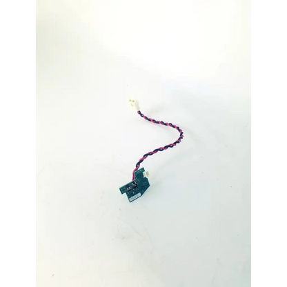 A compact green rev c board clb-0002 rev with twisted pink and black wire ending in a white connector