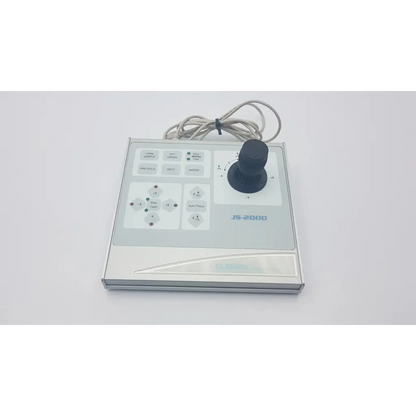 Silver clemex js-2000 microscope joystick controller with black central joystick and multiple labeled buttons