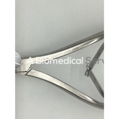 Stainless steel codman 2084r forceps with polished metallic finish and engraved handle markings for surgical use