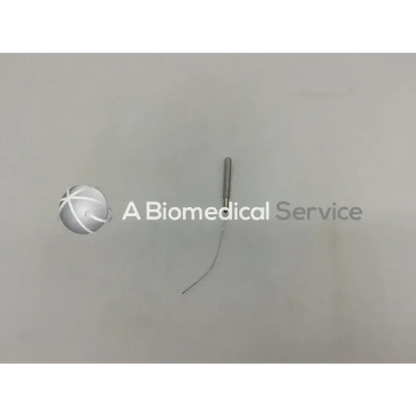 Silver metallic acupuncture needle with slender curved shaft and pointed tip in codman symmetry dilator garret 1.0mm