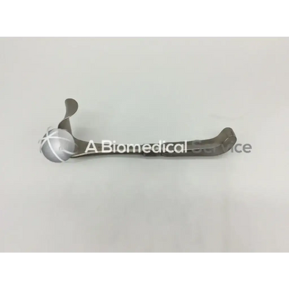 Silver-toned Codman 50-4112 surgical retractor with curved design and cross-hatched spherical handle for precision use