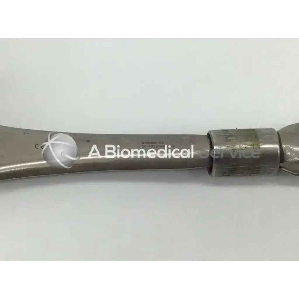Silver metallic codman 50-4112 surgical retractor with engraved branding and textured grip for precise surgical use