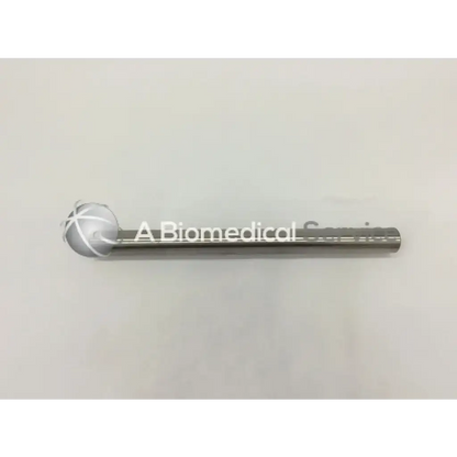 Silver metallic cylindrical symmetry surgical vertical bar with spherical engraved cross end cap Codman 50-4553
