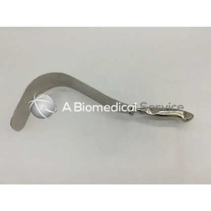 Silver codman lamb handle surgical retractor with curved metallic blade and ergonomic handle for precise tissue retraction