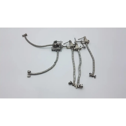 Silver metallic codman retractor hand rest with articulated arms and aesculap ff270r yasargil flexible arm