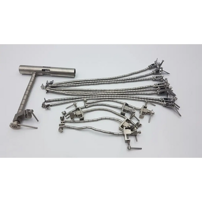 Set of metallic aesculap ff270r yasargil surgical instruments with articulated arms and codman retractor hand rest cylindrical handle