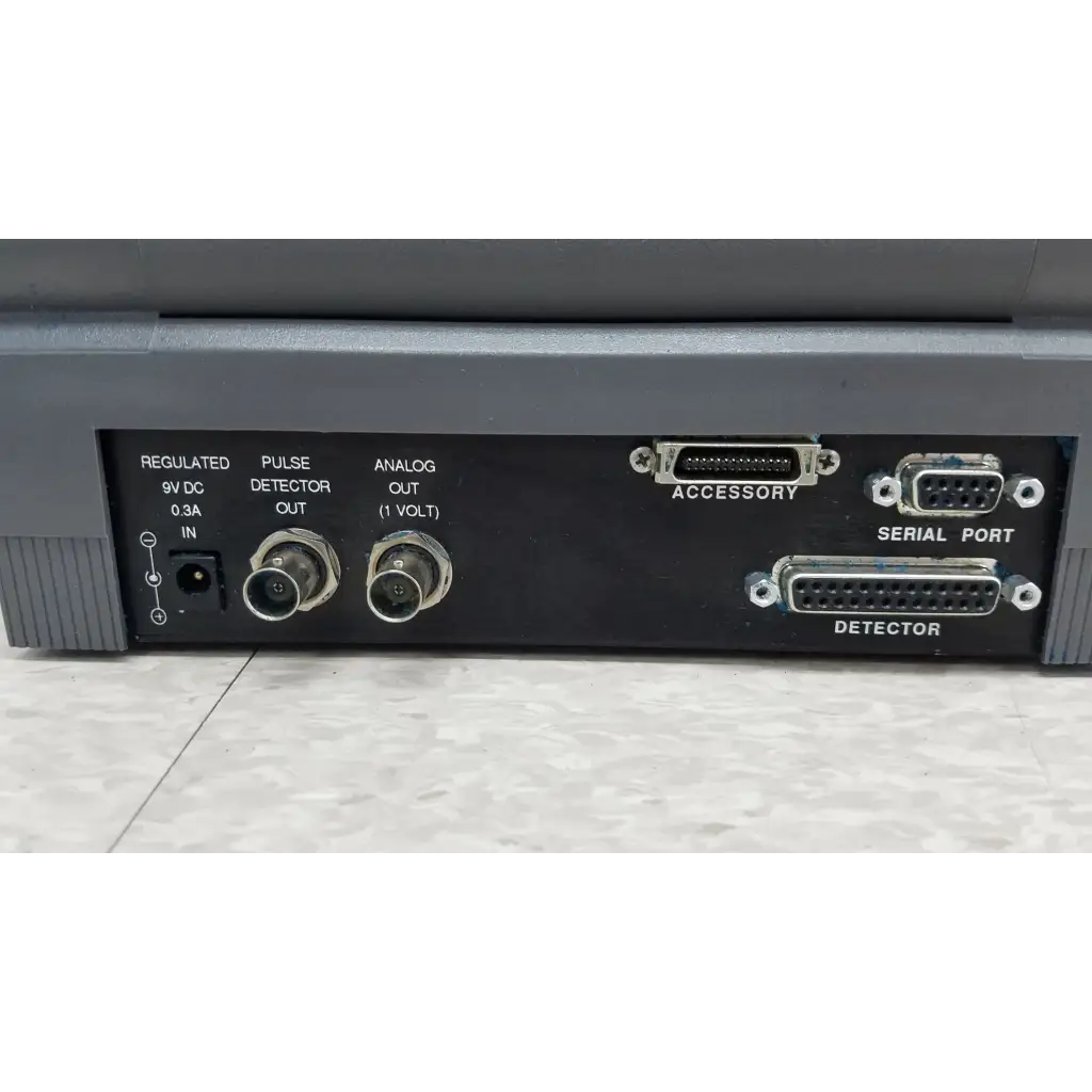 Back side of gray coherent labmaster plus laser power meter with labeled ports for pulse detector output and power input