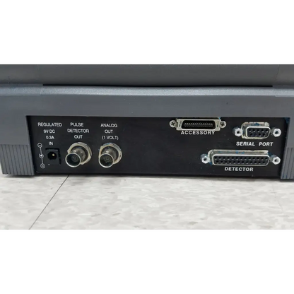 Back side of gray coherent labmaster plus laser power meter with labeled ports for pulse detector output and power input