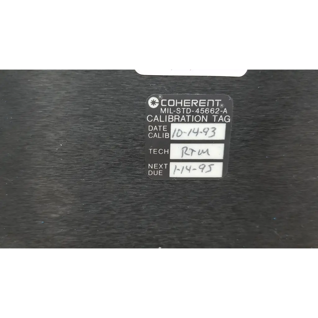 Black coherent calibration tag with white printed and handwritten text for labmaster+ laser power meter power meter use