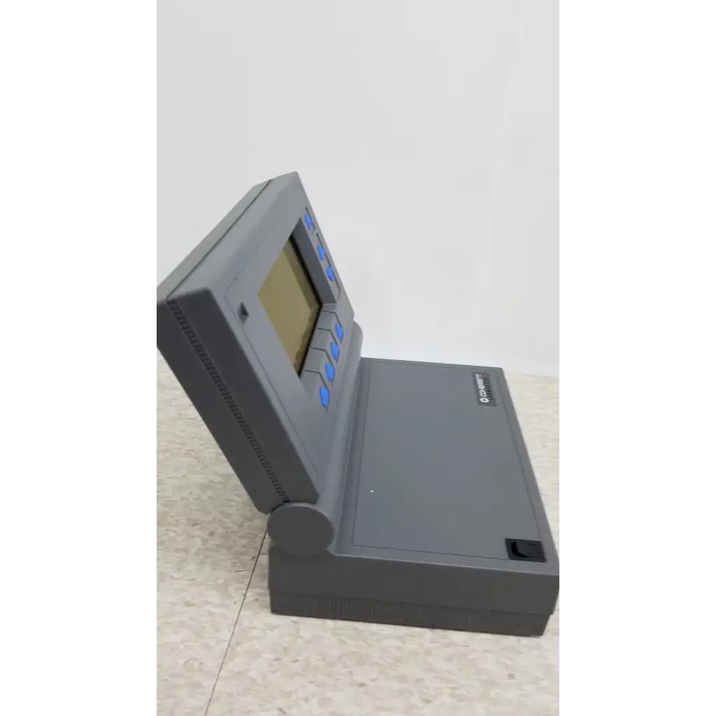 Gray plastic handheld calculator with small screen and blue buttons for coherent labmaster plus laser power meter use