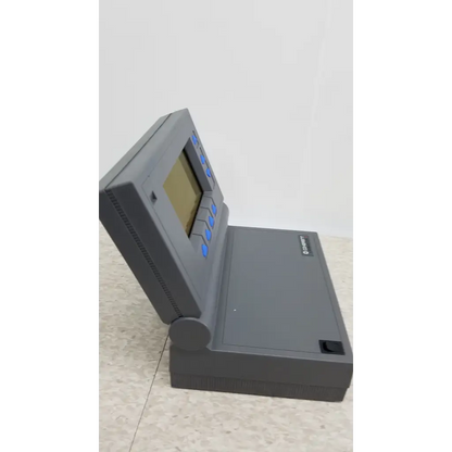 Gray plastic handheld calculator with small screen and blue buttons for coherent labmaster plus laser power meter use