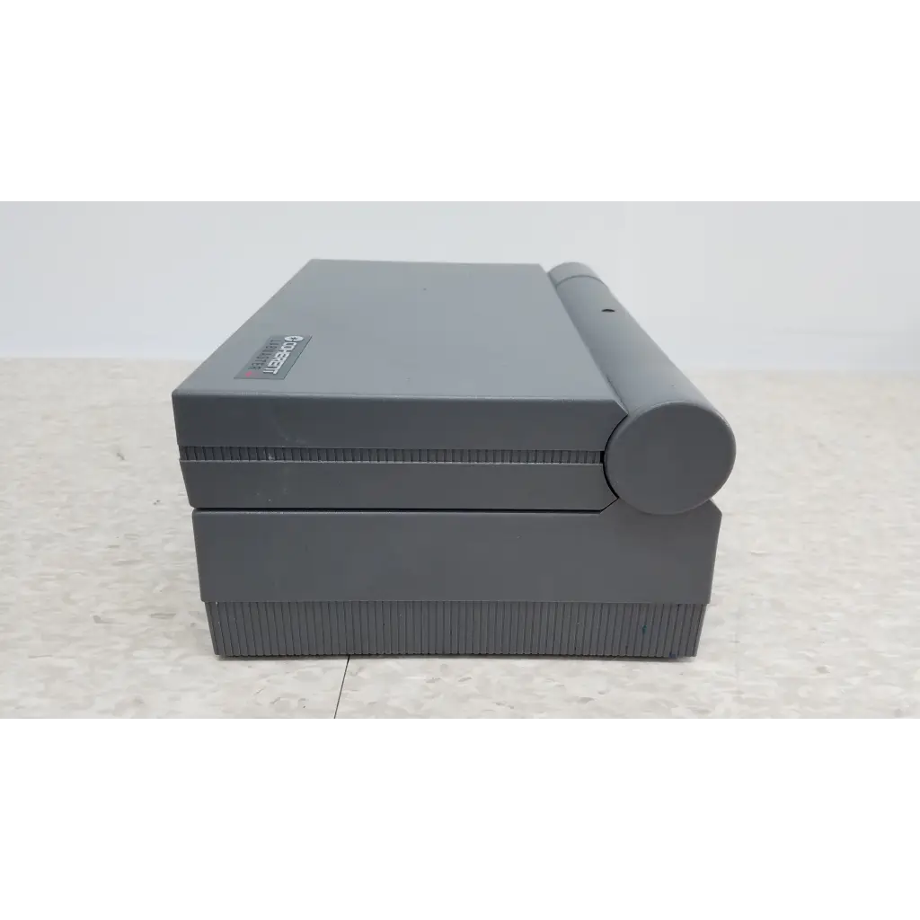 Gray plastic nintendo game boy advance sp with curved hinge shown alongside coherent labmaster plus laser power meter and sensors