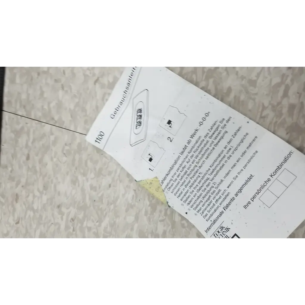 White paper instruction manual with black text and diagrams for coherent labmaster+ laser power meter shows torn corner and adhesive residue