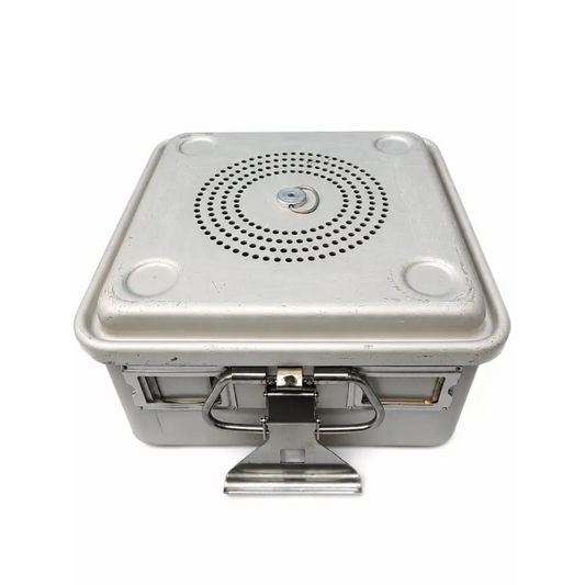 Silver metallic sterilization container with removable perforated basket and filter plate and sturdy metal latch