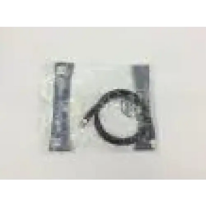 Black coiled comprehensive 005622-00 high definition sdi bnc cable 3ft between two metallic components in clear plastic packaging