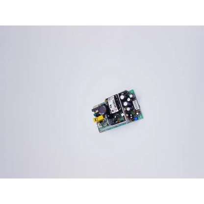 Green circuit board with black components and yellow connector of condor gpm40a power supply 40w 100-240v