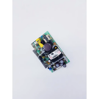 Green printed circuit board of condor gpm40a power supply with black components yellow labeling and large purple capacitor