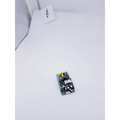 Green circuit board with black components and yellow connector in condor gpm40a power supply 40w 100-240v model 19472