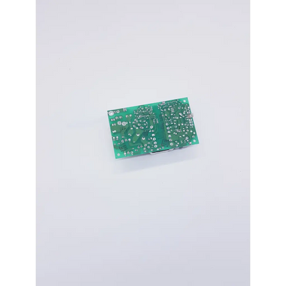 Green rectangular circuit board with silver soldered components and printed markings in condor gpm40a power supply