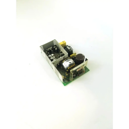 Silver metal condor gpm80p power supply with black capacitors and yellow connectors on a green circuit board