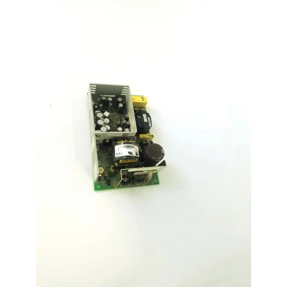 Silver metal condor gpm80p power supply with black yellow capacitors and green circuit board labeled components