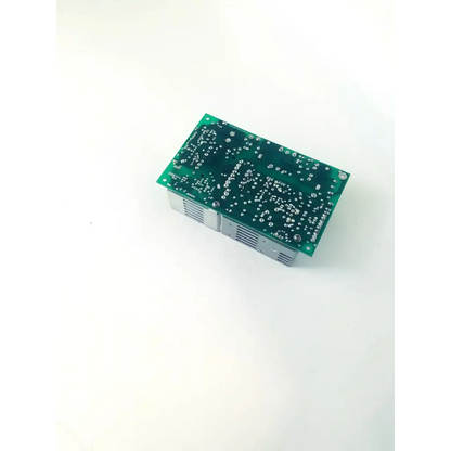 Green rectangular circuit board with silver components and ventilation grilles of condor gpm80p power supply