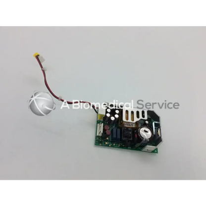 Green circuit board with black and silver components connected to white sensor showing condor gsm28-12g 60hz switching power supply