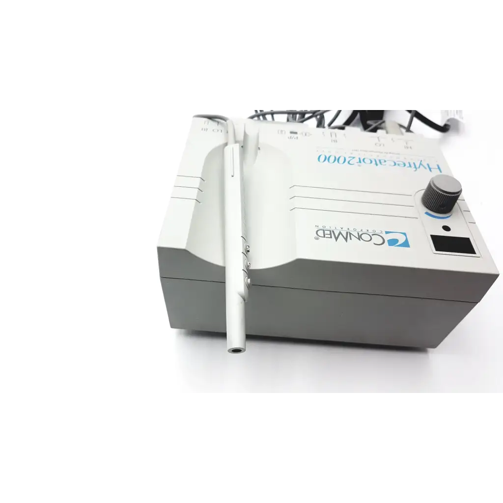 White and gray conmed hyfrecator 2000 desiccator unit with silver push pencil handpiece and disposable tips