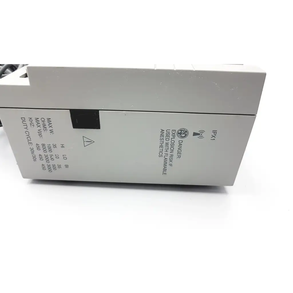 Gray industrial-grade conmed hyfrecator 2000 desiccator unit with black warning label and push pencil handpiece side view