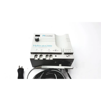 White and gray CONMED Hyfrecator 2000 ESU high-frequency desiccator with power cord and tubing
