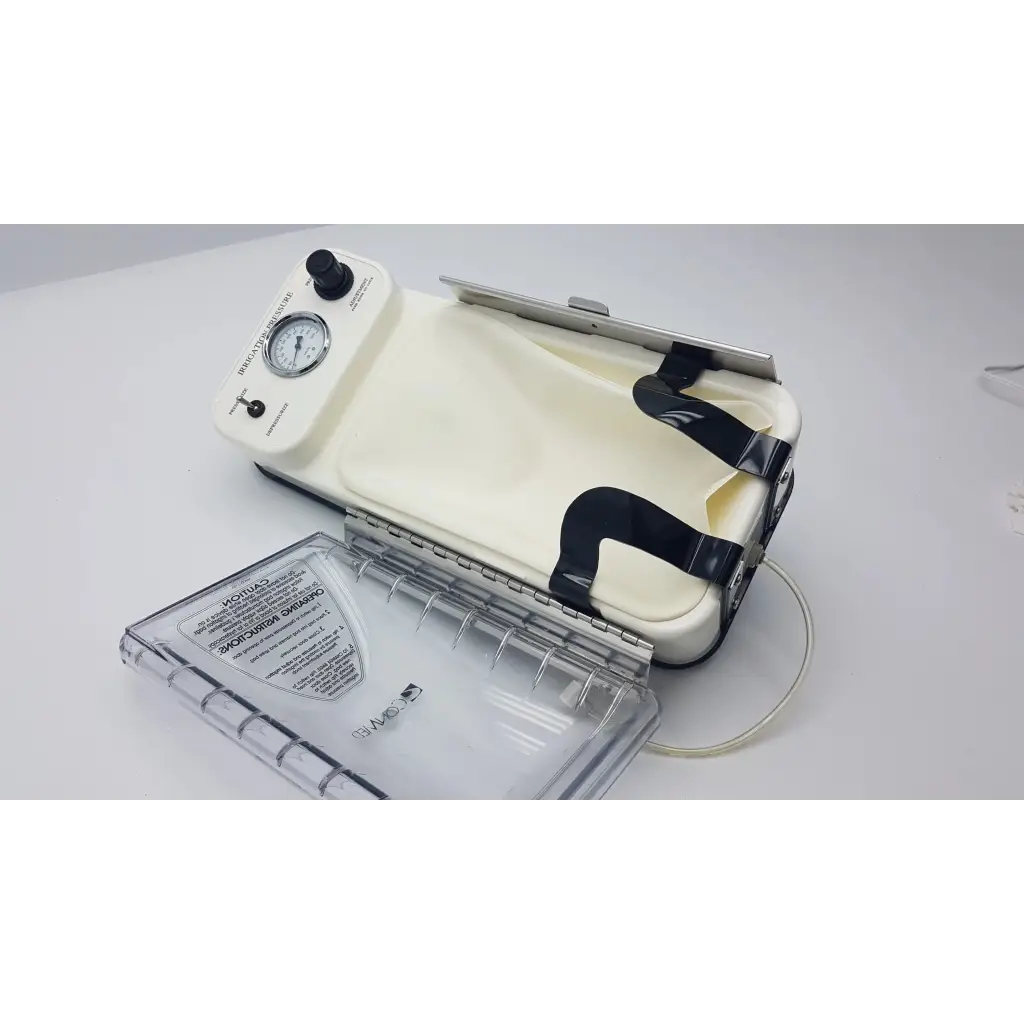 Cream-colored conmed irrigation pressure system vacuum sealer with black straps and pressure gauge on control unit
