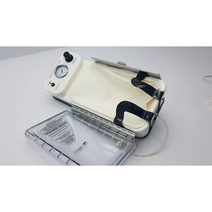 Cream-colored conmed irrigation pressure system vacuum sealer with black straps and pressure gauge on control unit